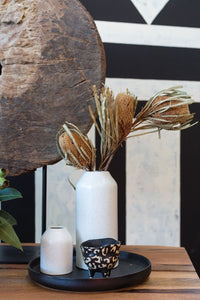 Tall white ceramic bottle vase