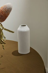 Tall white ceramic bottle vase