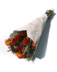 La Luna large preserved flower bouquet in red, orange and green, wrapped in paper