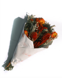 La Luna large preserved flower bouquet in red, orange and green, wrapped in paper