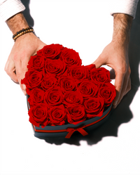 Eighteen red preserved roses in a heart-shaped box