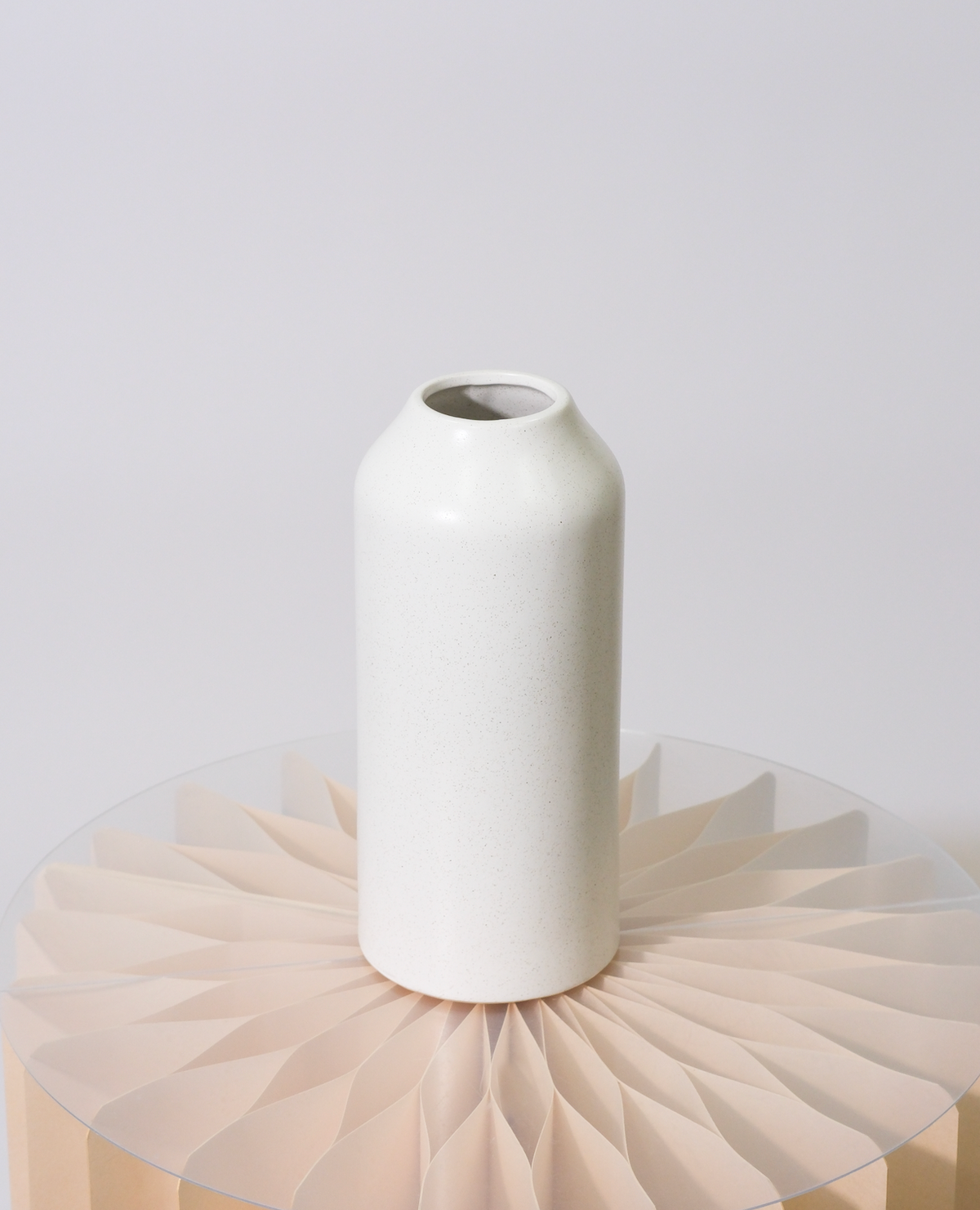 Tall white ceramic bottle vase